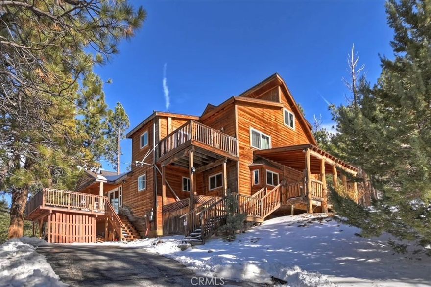 PRICE REDUCED!! Stunning Big Bear Vacation Home! Escape to luxury and tranquility in this expansive Big Bear vacation home, offering 3745 sqft of living space. Nestled on a generous 23,507 square foot lot, this property is an entertainers dream on a 1/2+ acre and a relaxing environment, which is great for large gatherings or a serene getaway. This grand home boasts 7 large bedrooms and 6.5 bathrooms, providing ample space for family and guests. Enjoy the open concept living area with high ceilings, abundant natural light, and elegant finishes throughout. The property has a floor-to-ceiling fireplace in the great room, quartz counters in the kitchen, stainless steel appliances, island, prep sink and two cooktops. Home includes multiple living areas, a game room and loft. Close to the lake and town easy access to water activities, dining and shopping. Don't miss your chance to own this exceptional property. Schedule a tour today and discover why this house is the perfect place for your next getaway!