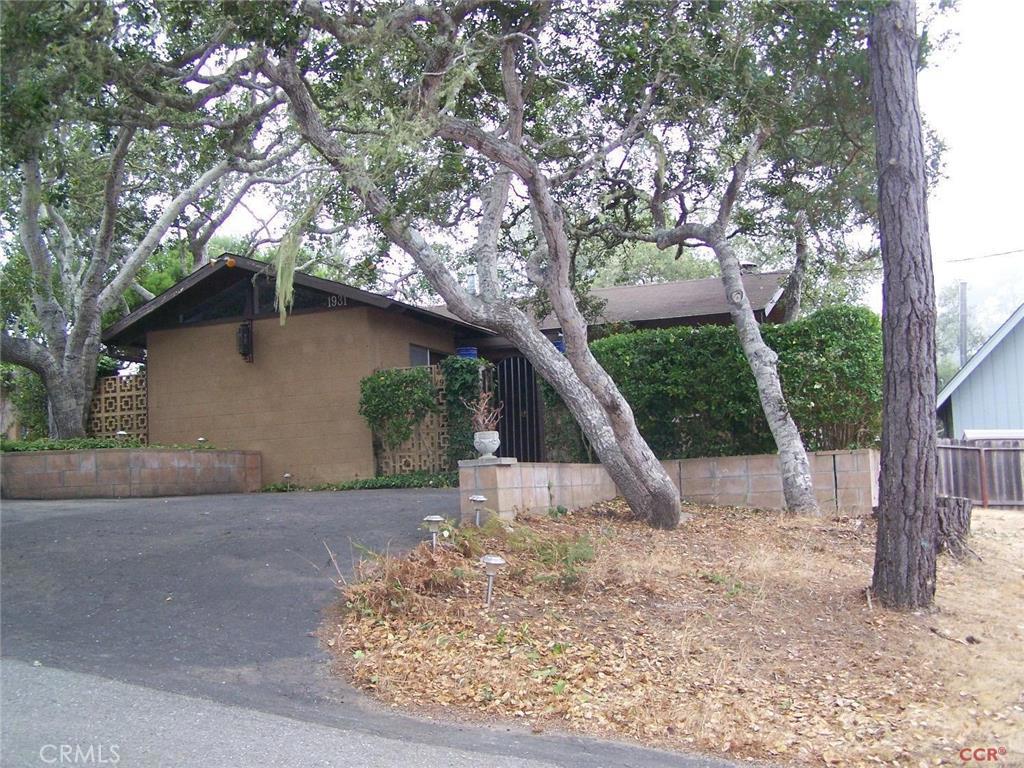This is real Cambria. Quiet area in the trees. First time on market for this Much Loved Home, owner occupied for over 50 years! Single level, 2 Bedroom, 2 Baths surrounded by 1/4 acre of private gardens and decks. Vaulted beam ceilings throughout. Built-ins and unique fireplace add to comfort and interest. This home is a retreat, perfect for full time or vacation living. Living and Master Suite added in 1991, with wood floors, walk in closet, large deck. Surrounded by Oak and Toyon trees. Peaceful is the word. Lot Description: irregular, street to street