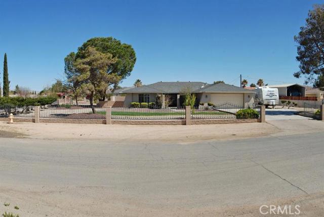 Located on quiet street in the Desert Knolls of Apple Valley with in-ground pool and RV parking. Bright and sunny remodeled Kitchen with custom counter tops, inset appliances, plenty of cabinetry for storage and Breakfast bar. Open dining area and family room with plenty of windows to let the light in. Living room with custom bricked fire place. Plenty of room in the back yard for the entire family, covered patio runs the length of home. RV access and parking. Association Amenities: None # of RV Spaces: 0 Special Features: PTRYNONE Lot Location Type: Standard Location # of Attached Spaces: 2 # of Detached Spaces: 0