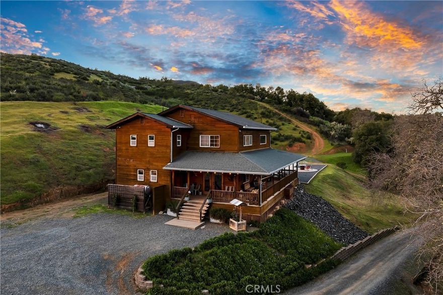 BEAUTIFUL modern style farmhouse on 12+/-ACRES in desirable Scotts Valley! Set near the end of a quiet road in North Lakeport, this property is a dream! Complete with the charming wrap around porch, this property has it all- a turn-key 4bed/2bath, 2246sqft home with an open kitchen, large dining area & living room with approx. 20ft tall ceilings, huge walk in pantry & separate mudroom, and one bed/one bath, all on the main level. Upstairs you'll find the remaining 3bed/1bath, including the primary with a massive walk in closet. Out back entertain all of your friends & family with the custom built 10ft deep salt water POOL with waterfall, huge concrete patio, firepit, perfect for the Lake County summers! Hear nothing but the birds and the seasonal creek running out front, truly an absolutely serene & peaceful setting. Nice area below for your horses, large chicken coop, additional pens for the 4H animals, large garden area, and a 1400sqft solid wood BARN/SHOP that could easily fit vehicles, farm equipment or would make an awesome auto shop (220v in shop, & 400amp total on property). Lots of useable land, with enough room to park multiple vehicles, boats, room for big rig turn around, and includes 30ft metal RV cover, & RV hook up area. Negotiable fully finished shed with AC/heat, water, kitchenette (currently used for nail shop but could work for possible tiny home/ADU!) Multiple roads and hiking trails make this just a perfect spot for anyone who is looking to enjoy the outdoors year round. Great producing well, whole home generator ready, super WiFi available, & complete privacy yet less than 10mins into town to Safeway shopping center and Lakeport schools. DREAM country property!
