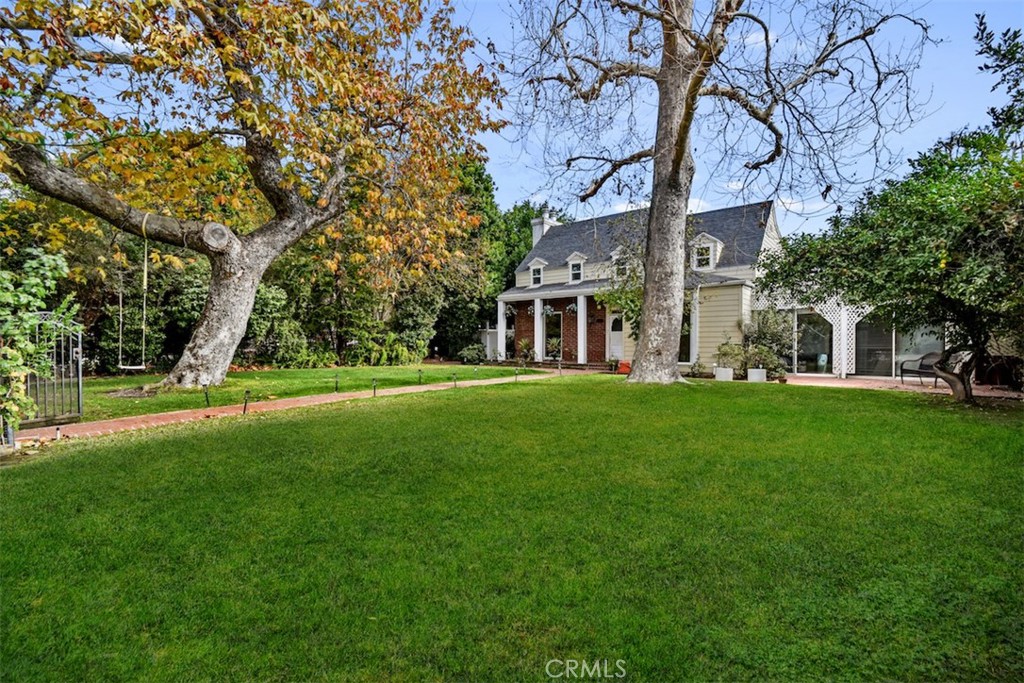This coveted, Colfax Meadows home, has quite a lot of character and offers a blend of traditional charm with modern upgrades. The fact that it was once a celebrity estate and filming site adds an interesting historical aspect to the home. The 2-story layout with 5 bedrooms and 4 bathrooms, combined with a spacious open-concept kitchen and top-of-the-line appliances, really caters to those who enjoy both style and functionality.
The mature trees and privacy hedges make the outdoor space feel secluded, and the large park-like lawn is perfect for outdoor living and entertaining. Plus, the convenient proximity to shops, restaurants, CBS- Radford Studio Center- Award winning LAUSD Schools and the Farmer’s Market makes it a prime location for anyone looking to be close to the action but still enjoy a peaceful, private home environment.