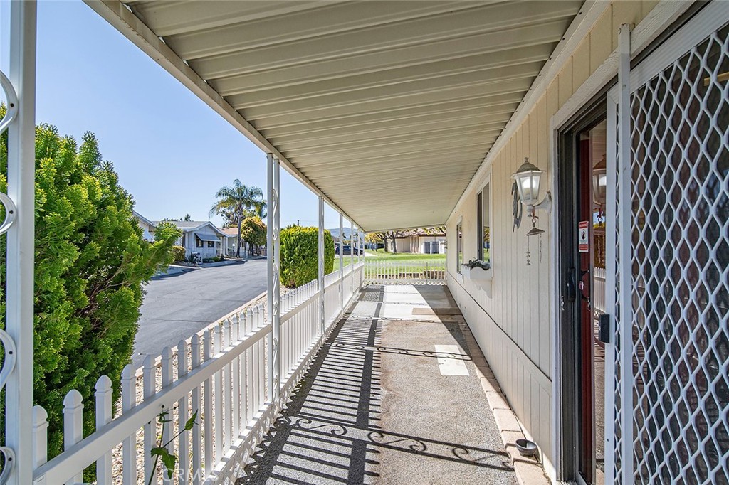 Beautiful triple wide in Mountain View Park. Move-in ready with fresh paint and new flooring. Boasting an over-sized living room with a fireplace, view windows, a bar with storage, and attached formal dining area with built-in hutch. The kitchen offers a pass-through with bar seating and a nook in the kitchen with built-in hutch. Off the kitchen is a large porch area where you can set up a nice table and lounge chairs for relaxing. The extra large primary bedroom has a wall-to-wall closet and a large private bathroom with a separate soaking tub and dual vanity sinks. The secondary bedroom is also large and sits just across the hall from the guest bathroom. The laundry room in this home is incredible in size and storage... and could double as an office. The carport has room for 2 cars and there is a very large storage shed with a window that could be used for a workspace. This home is situated on a corner lot just behind the clubhouse and close to guest parking. Hurry before this beauty is gone!!