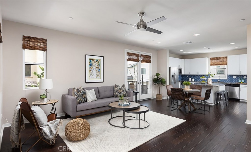 Seize the opportunity to live in the popular community of Circa in the heart of Downtown Anaheim. This turnkey townhome is a coveted end unit with plenty of natural light from windows on three sides and exhibits an array of upgrades and storage. The open floor plan leads from the great room with two balconies, one overlooking the lovely courtyard, to the beautifully appointed kitchen with Caledonia granite countertops and is ideal for entertaining. There is a convenient laundry room with built-in shelving and a powder room just around the corner. Upstairs, the master en suite has a large walk-in closet with built-ins, french doors to a balcony overlooking the courtyard and a private bathroom with dual sinks and step-in shower. Two additional bedrooms share access to a jack and jill bathroom. E-stone glacier-white countertops beautifully adorn the bathrooms. Additional amenities include woven bamboo window coverings, engineered wood flooring, a tankless water heater & central air conditioning. The 3-car garage has custom built-in cabinets, epoxy flooring and space for an office or gym. Live just blocks from several public parks and the Anaheim Packing District: with over 50 culinary experiences. It is home to the Packing House, Farmers Park, the Packard Bldg., the MAKE Bldg, Center Street Promenade and Leisuretown. Centrally located to the major entertainment venues of OC: Disneyland, House of Blues, Angel Stadium and Honda Center with easy access to the 5, 57 and 91 freeways.