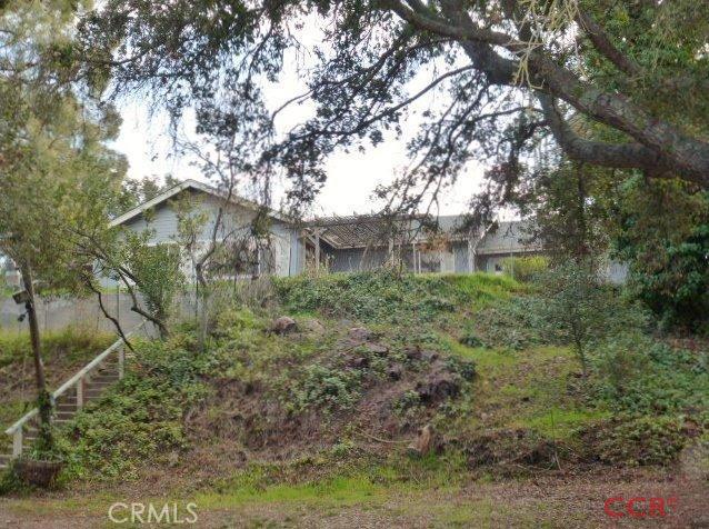 Gem of a location, surround by trees and views of the East foothills. Imagine a tranquil garden and room for all your Toys, outdoor living space for entertaining. Views from the living room, kitchen, and dinning area. Home is in need of some TLC. Semi-private location. Information deemed reliable, not verified by listing agent.