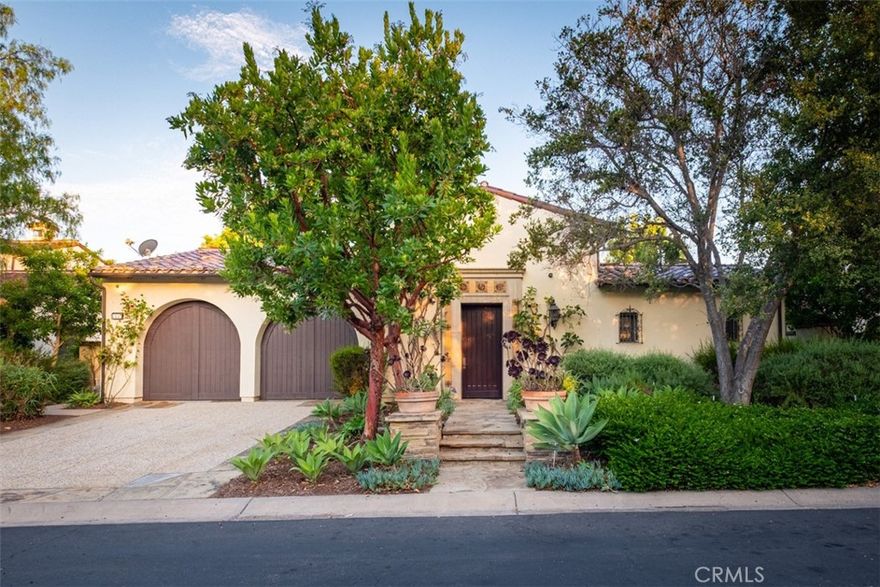 This exquisite Mediterranean inspired estate, nestled within the Villas Sycamores community of the prestigious Shady Canyon enclave, offers an unparalleled living experience.