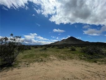 Nestled at the foothills of the majestic mountains in Apple Valley, this expansive 100-acre lot offers a rare and unparalleled opportunity for those seeking a vast and versatile property. Surrounded by the natural beauty of the High Desert, the lot boasts breathtaking panoramic views of the rugged mountains and pristine desert landscape, providing a serene and picturesque backdrop for your dream development.With 100 acres of sprawling land to explore and develop, the possibilities are virtually endless. Whether you envision creating a private estate, establishing an agricultural venture, or developing a recreational retreat, this sizable parcel of land in Apple Valley offers the perfect canvas for realizing your vision. The proximity to the mountains adds an extra layer of scenic beauty and potential for outdoor activities, making this 100-acre lot a truly exceptional investment in the heart of the High Desert. It is located next to Dale Evans PKWY and by the Walmart and Big Lots distribution centers, also close to the bright line west high speed rail project that will take people from Apple Valley to Las Vegas in about an hour.