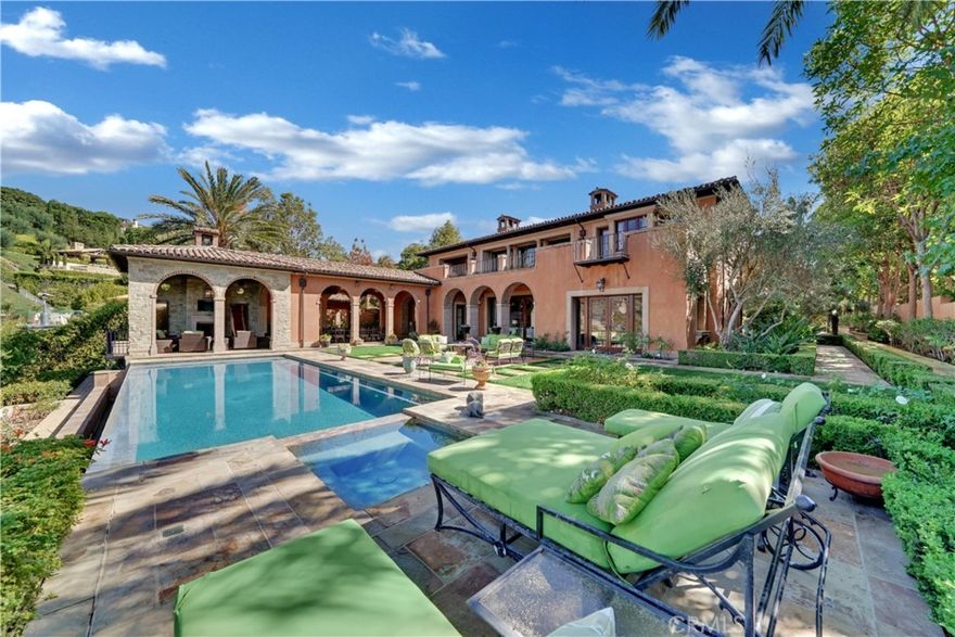 Full Ocean view Estate located within the gates of Newport Coast’s premiere private community, Pelican Crest. This custom estate offers timeless elegance and seclusion nestled on a 30,000 sq ft front row parcel showcasing breathtaking full ocean white water views of the California Coastline including Pelican Hill Golf Course, Catalina Island and Newport Harbor.  Enjoy the captivating sunsets  that rest upon the pacific ocean along with the evening view of Newport Beach City lights.
This exceptional estate is approximately 10,000 sqft that offers a private guest casita that is surrounded by a lush garden and water fountains. Upon the formal entrance your greeted with a elaborate limestone winding staircase and elegant chandelier that sets the tone of this exceptional estate which includes a total of 6 bedrooms each with their own private balcony, 8 bathrooms, library/office, formal living room, formal dinning room, wine cellar, two additional family rooms, movie theatre, chefs dream kitchen, butler pantry and four car garage with gated driveway that could accomidate up to six additional cars.
The expansive lush exterior grounds adorned with citrus groves, a rose garden, multiple fountains, infinity pool, BBQ with exterior dining pavilion , covered heated decks and loggias throughout. This magnificent estate offers every amenity one could dream of in a coastal retreat.