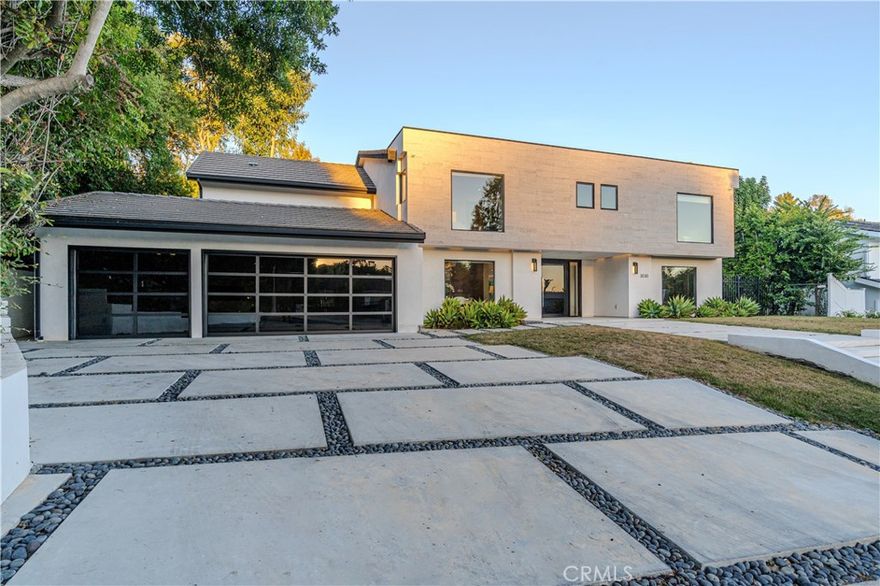 Welcome to Benedict Hills Estates Community on Mulholland Dr. in Beverly Hills. This exclusive enclave showcases a harmonious blend of architectural styles and meticulously manicured landscapes. Previously listed in 2015 after 36 years, this traditional 70's home was transformed in 2018 into a sophisticated modern open floorplan embodying California living.



The property features a striking curb appeal, 40' Fleetwood automatic sliders, gourmet granite countertop island kitchen, Italian Scavolini cabinets, main floor living space ideal for indoor-outdoor entertaining, ensuite guest bedroom, office, and more. The backyard includes an in-ground infinity edge pool and spa with an adjacent custom outdoor kitchen.



Upstairs, three ensuite bedrooms with walk-in closets await, with the option to upgrade to a luxurious primary suite offering a Japanese soaker tub, shower, dual vanity sinks, walk-in closet, and private balcony. A three-car garage with an electric charger outlet completes the property. Explore the limitless possibilities for your lifestyle in this exceptional home.