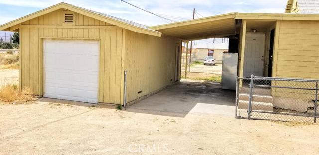 Corner house with 4 bedrooms and 2 full baths; Detached 1 car garage and a car port in rear breezeway; Washer & Dryer hook up inside house; Ceiling fans located in each rooms. Association Amenities: None Frontage Type: Dirt Road Landscaping: Natural Patio: Covered Deck