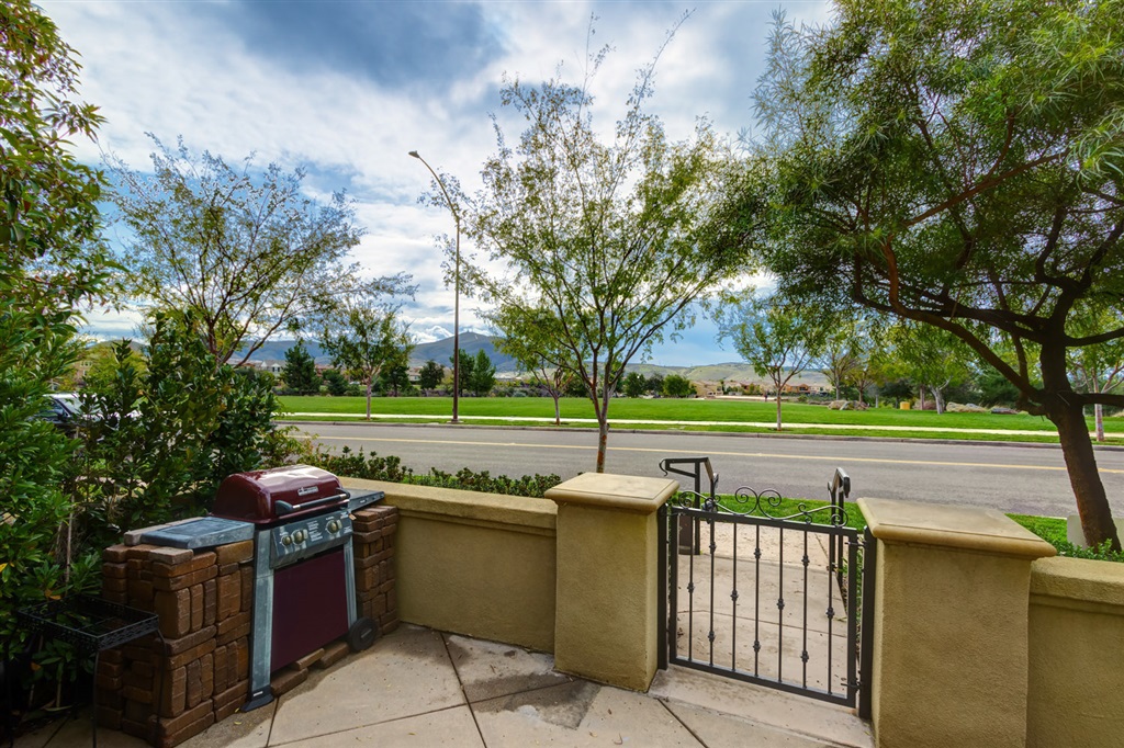 This gorgeous 4 bed/3bath Garretson townhome is nestled between TWO of Del Sur’s best parks! Enjoy picturesque, south-facing views, of Village Green Park & Black Mtn from the quaint front courtyard. Step inside to a generous, bright & open floor plan with luxurious modern finishes & park views from every room. The interior features a beautiful chefs kitchen, 1st-floor bed/bath & a spacious master suite. Enjoy family friendly Del Sur living: award-winning PUSD schools, community parks, pools & amenities. Don't miss your chance!!! This gorgeous Garretson townhome is located in one of the most coveted areas in all of Del Sur. Nestled right between TWO of the best parks in Del Sur, practically every room in the house has a view and enjoys privacy that’s hard to find in nearby areas. Enjoy gorgeous south-facing park and Black Mountain views from the front courtyard. On the other side of the house, views of Aubrey Park and the rolling hills in the distance are what you have to look forward to. Step inside to a generous, bright and open floor plan with luxurious modern finishes and custom upgrades throughout! Steps from the front door is Village Green Park with a large lawn, and walking trails. Steps from the garage side of the home is picturesque Aubrey Park with a wide open lawn and a great kids playground! The chef’s kitchen boasts stainless steel appliances, quartz countertops, 5-burner range with dual oven, and a spacious food prep island with dine-in bar. The rest of the great room features upgraded flooring, custom statement travertine tile walls, and windows that flood the space with natural light. A first-floor bedroom and bathroom is perfect for a home office, senior living, or ample space and privacy for guests. The bathroom has gorgeous tile, quartz countertops, and a senior-friendly zero-threshold shower. The master suite is your private retreat with rows of windows featuring park views. The spa-like modern master bath has a soaking tub, walk-in gla...