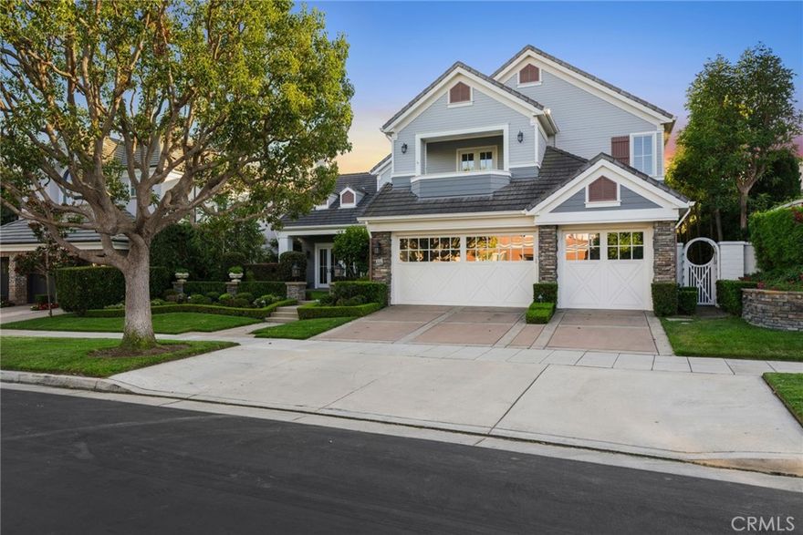 Introducing a residence of unparalleled sophistication that seamlessly blends elegance with comfort. This highly sought-after Providence Plan 3 boasts 5 spacious bedrooms and 5.5 opulent bathrooms, situated on an expansive lot that offers a rare combination of privacy and tranquility. Upon entering, you are welcomed by grand foyer with double vaulted ceilings and exquisite stone floors that extend gracefully throughout the home, accentuated by elegant plantation shutters and a stately curved staircase. The main level is anchored by an open concept gourmet kitchen, a true culinary masterpiece. This space features a vast center island, ample seating, a premium Sub-Zero refrigerator/freezer, a 6-burner gas cooktop with a griddle, a generous walk-in pantry, a charming breakfast nook, and an impressive breakfast bar. This kitchen is meticulously designed to blend both functionality and style, transforming meal preparation into an enjoyable experience. The kitchen flows seamlessly into a spacious family room, where a wall of custom cabinetry and an inviting fireplace create a warm and inviting ambiance. Whether hosting a formal dinner in the expansive dining room or enjoying informal gatherings on the large brick patio, this home offers a diverse array of entertaining spaces. The patio is equipped with a built-in BBQ and a comfortable seating area, ideal for outdoor dining and relaxation. The expansive grassy yard further enhances outdoor enjoyment, providing ample space for recreation and leisure. Residents of One Ford Road will benefit from a wealth of unparalleled amenities within this prestigious 24-hour guard-gated community. Facilities include two pristine swimming pools plus a tot pool, a cutting-edge fitness center, a refined clubhouse, a putting green, a volleyball court, a half-court basketball area, a playground, and a croquet park. Additionally, the community provides the services of an athletic director, ensuring a continuous array of engaging activities. This Providence Plan 3 home transcends the concept of mere residence; it represents an exceptional lifestyle. Experience the ultimate fusion of luxury, convenience, and community living.