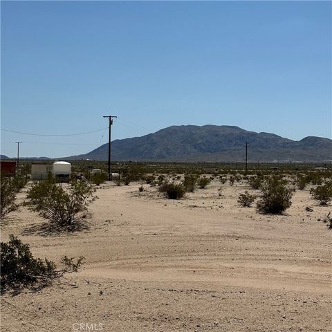 Photo of 1142 Samarkand Drive, 29 Palms, CA 92277 (MLS # JT24055235)