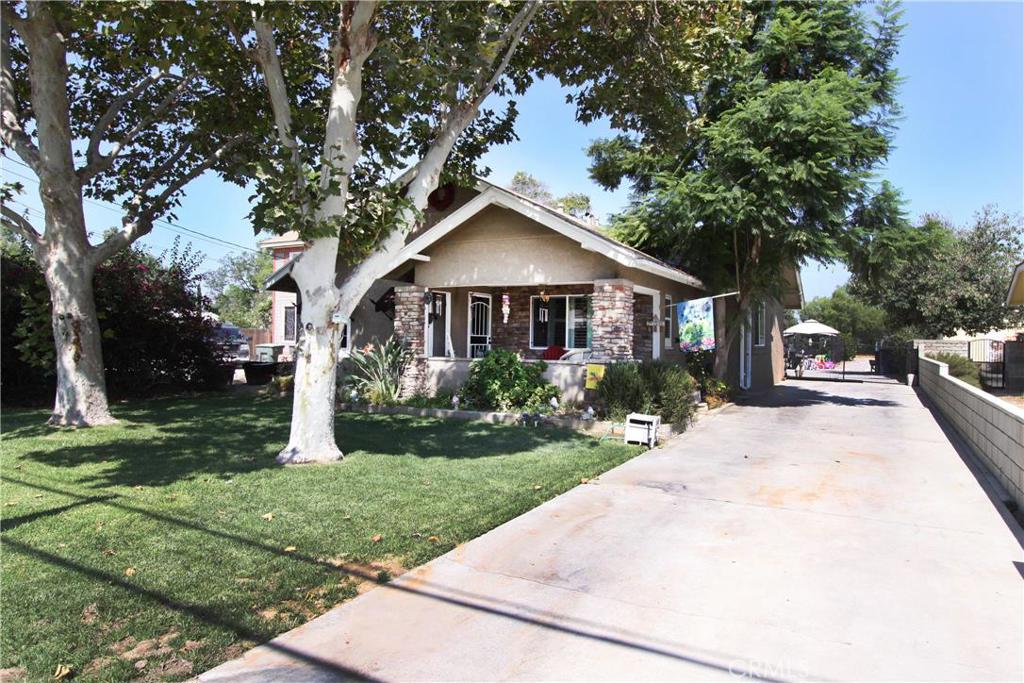 HUGE PRICE REDUCTION $20K !!!! Nicely maintained Craftsman Pool Home in the Wood Streets Community!!! Everything has been upgraded. The spacious Kitchen has Tiger Granite counter tops and Island. The kitchen also features newer dark wood cabinetry, all stainless steel Kenmore appliances and large walk-in pantry. The Living room has a beautiful fireplace and mantle. There's Hardwood flooring throughout the home. This house has all vinyl dual pane energy efficient windows with custom shutters. Custom bathrooms with a jacuzzi tub and nice fixtures accent the property perfectly. AC & Heating system is brand new including duct work. The huge lot has a nice pool with a huge fire pit, mature fruit trees (Peach, apple, orange, lemon, lime and kumquat) and plenty of room for all your toys including an RV. The over sized 2 car garage is 24'x26 with plenty of cabinets for extra storage space. The half acre lot will support a second home and has an excellent view of Mt. Rubidoux for fire works on the 4th. Come see this unique Wood Streets Property and entertain family and friends.
