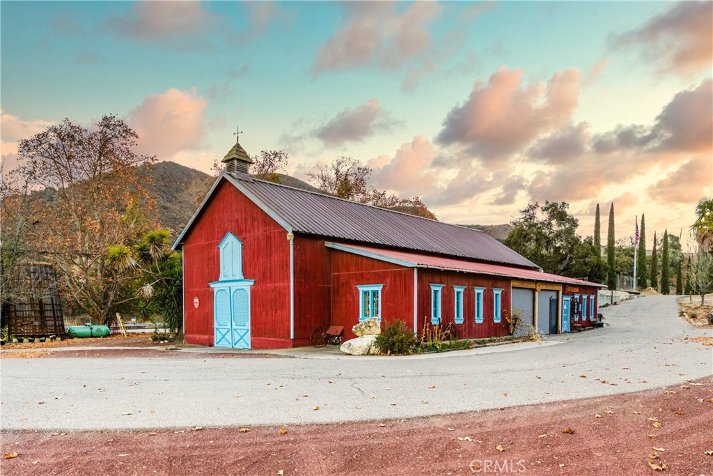 Mosby Vineyard & Winery offers an incredible opportunity to own one of the oldest and prominent wine producing properties in the Santa Ynez Valley. Easily seen from Hwy 101 just south of Buellton off the Santa Rosa Rd exit, this 208 acre property was planted by pioneer winemaker Bill Mosby in 1977. The red barn housing the Mosby Tasting Room is a well-known landmark for locals and visitors alike. Still operating under the original wine permit issued by Santa Barbara County in 1978 this historic property is ready for its next chapter to be written. The unique micro-climate of this location is created by ocean breezes from both Gaviota to the south and Lompoc to the west with clay loam and shale soils supporting approximately 18 acres of Italian varietals including Sangiovese, Pinot Grigio, Sagrantino, Dolcetto and Nebbiolo which demands specific conditions of this vineyard-site to thrive. The rich history of this property is apparent with the old buildings including an Adobe built in 1853. The spirit of Italy is alive and well with the impressive double bocce court and plaza perfect for events and gatherings. Inventory, brand, farming and winery equipment are included in the sale.