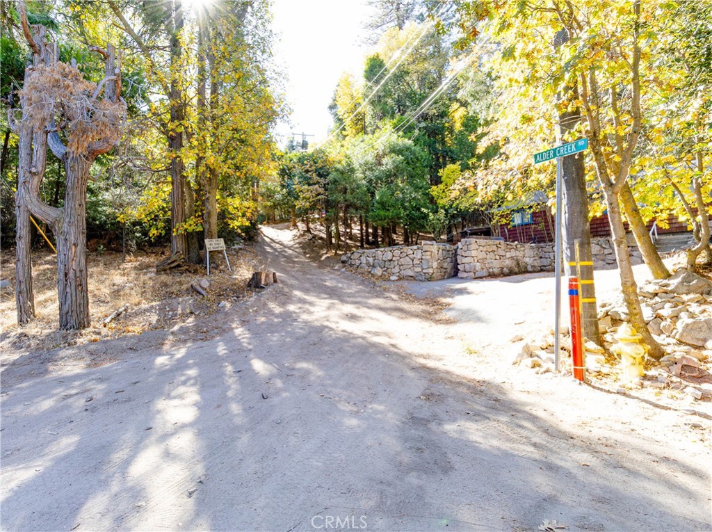 Gorgeous Mountain Property. Experience the beauty and tranquility of this serene, wooded retreat in a forested setting. Located in a rural area off the grid, this property is situated in Cedarpines Park, an unincorporated community in San Bernardino County, just 10 miles north-northwest of San Bernardino. Nearby cities include Crestline, Lake Gregory, Twin Peaks, Rimforest, Blue Jay, and Silverwood Lake. With endless possibilities, this property offers the perfect opportunity to invest in a vacation home, a custom-built residence, or a cozy cabin. Accessed by a short 4x4 off-road trail from Alder Creek Rd, you’ll find neighboring homes along the way, leading you to your private mountain retreat.