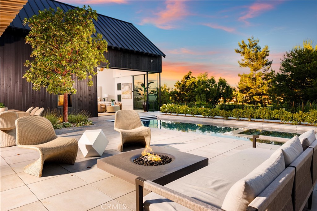 Enjoy sit-down golf course views from this stunning single level custom home in the prestigious guard-gated community of Big Canyon. Ideally located on a very private oversized lot with prime views of both the 14th fairway and 16th green. Offering 5 bedrooms (including casita),
5 ½ bathrooms, butler’s pantry, wine wall, soaring vaulted ceilings with exposed trusses and 36 ft motorized doors that open from the great room to a meticulously landscaped yard and pool, creating a seamless flow of indoor-outdoor. With exquisite finishes throughout, this Laidlaw Schultz designed home has the coolest vibe and will not disappoint.
