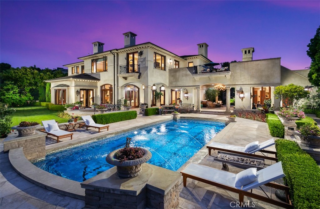 Situated just steps away from the coastal waters of the Pacific, and tucked away within the prestigious guarded gates of Pelican Point sits 7 Shoreview. Exuding an unparalleled sense of luxury and exclusivity, 7 Shoreview stands apart with its remarkable double lot and expansive half-acre grounds. This recently updated custom estate epitomizes sophistication, seamlessly blending meticulous architecture with thoughtful design that creates an environment like no other. Every detail has been carefully considered & curated, evident from the moment you pass through the solid wrought iron front gate. The exterior boasts exquisite stonework, lush gardens and multiple outdoor lounging, dining and relaxation pavilions. Inside, the quality of materials, unique blends of stones, woods, metals and design showcase an environment of living highly sought after but hardly found in Newport Coast. Multiple sets of French doors grace each level, effortlessly connecting the indoor and outdoor spaces together. On the main level is a unique wood paneled office, 2 guest suites, multiple lounging areas, dining room, family room, formal spaces and oversized kitchen along with an outdoor pool house sitting towards the west end of the parcel. On the second level, outside of multiple other suites and an upstairs media room, the primary suite encapsulates grand scale living with an oversized bedroom, retreat, and bathroom with heated floors and towel bars while still maintaining the warmth and comfort of a cozy & intimate space. Throughout the rest of the property you will find multiple lounging and relaxation spaces, an elevator, a day lit basement, sauna, an oversized 4 car garage and much more. The property also features private gate access to the Crystal Cove State Beach from within the community. Completing this estate is direct access to world class shopping, dining, beaches and the Pelican Hill Resort just up the street. Don't miss your chance to immerse yourself in this coastal oasis and experience the epitome of coastal California living.