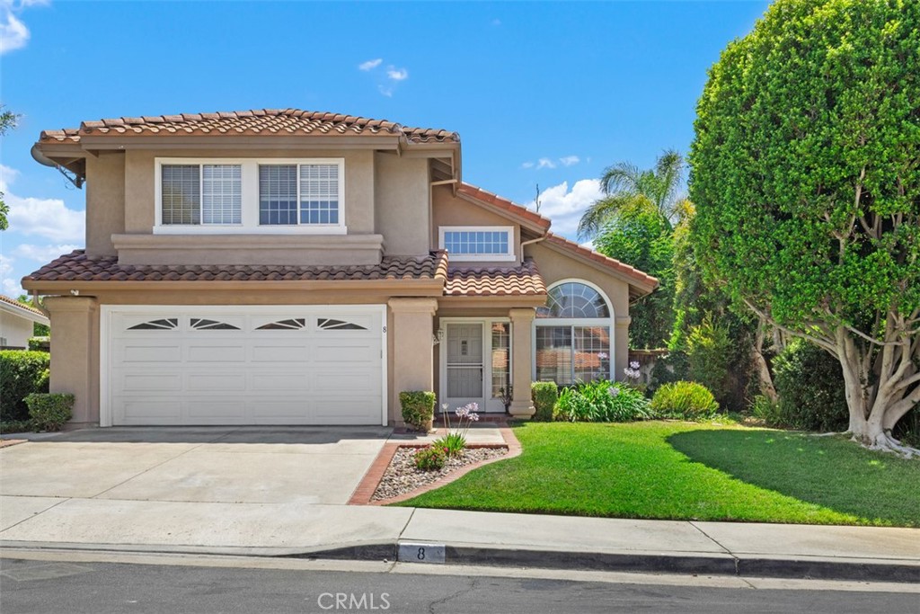 Here is your opportunity to live in the highly desired Seranada community of RSM. Rancho Santa Margarita is master planned community that offers so many amenities to its residence. Amenities such as pools, sports courts, parks, a splash pad; and several options for shopping or dining. Most within walking distance. In this property, you would Live steps from the beautiful O’Neill Regional Park and enjoy being just a short distance from the Beach club at the lake. This homes layout offers 4 bedrooms upstairs as well as 2 full bathrooms and a half bath located on the first floor. Enter on the first level, into a large living room with soaring ceilings and natural lighting. Walk through to the kitchen that offers granite counter tops, stainless steel appliances, recessed ceiling with canned lighting and tile flooring. Capture a view of the lush green backyard from the large window above your kitchen sink. Through the kitchen, enter a breakfast nook which leads to the family room complete with fireplace and French doors leading outside. A dedicated laundry room is conveniently situated next to the family room, accessible directly upon entering from the garage. The attached, 2-car garage offers storage cabinetry and has a separate entrance as well. You’ll find the primary bedroom located at the top of the stairs boasting high cathedral ceilings and a large window facing the rear of the home. This room also provides ample closet space and an ensuite bathroom with soaking tub. Another full bathroom with dual sink vanity is found convenient to the 3 secondary bedrooms down the hall. Now that I have guided you through, come take a look for yourself and see if this home is just right for you.