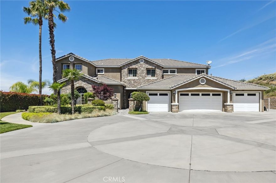 Welcome to this exceptional custom-built Simmons estate nestled in the coveted Whisper Ranch community. Gated and perched on a serene cul-de-sac, this home offers privacy, luxury, and spectacular mountain views.

Property Details: Built in 2004, 0.69 acre, 5697 Approx living space, 4 Bedrooms, 4 full baths, (plus 2 guest half- bath)

When arriving, a grand circular driveway greets you, along with charming lawn space and putting green. High ceilings and an entire wall of windows flood the home with natural light, highlighting the panoramic mountain views—ideal for both casual living and upscale entertaining. 

The gourmet Kitchen & Dining offers a chef’s kitchen which is a beautifully & newly remodeled showpiece, featuring: Expansive Quartz countertops, Built-in stainless appliances that includes a 48” range & dual dish washers, Convenient butler’s pantry, Seamless flow to the family room and covered patio with built-in BBQ—perfect for indoor/outdoor gatherings  

Your private Living Quarters features a primary Suite: Secluded from guest rooms, with a cozy fireplace, spa-inspired marble bath, walk-in closet, and breathtaking views, as well as three generously sized guest suites, each with private en-suite baths.

Additionally, this home offers plenty of entertainment Amenities that include an elegant wine storage space, a fully equipped theater room, a spacious game room with GOLF SIMULATOR, an open, airy upstairs loft for flexible use and a Built-in sound system throughout common areas.   

This Estates Outdoor Lifestyle is designed for outdoor living and entertaining: Take note of the multiple stone patios & deck with informal courtyard, an inviting fire pit lounge area, ample storage for vehicles and toys and an expansive 4-car garage.   

The Systems & Comfort of this gem offers, dual HVAC systems: zoned climate control with dedicated units per floor, as well as a central vacuum system for ease of maintenance.  

This beautiful residence is situated in the peaceful Whisper Ranch community, is zoned for the Yucaipa-Calimesa Unified School District and has easy access to local parks, trails, and amenities in Yucaipa and Calimesa.

This unique estate delivers the rare combination of a private gated location, entertainer’s design, and everyday luxury. From the sophisticated culinary and entertainment spaces to sweeping scenic views, this home exemplifies premier living in Yucaipa. Your new life starts here! Tour your dream home today!