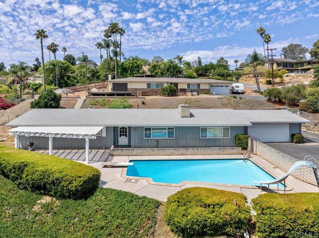 The value is here with this 2000+ sq foot home that sits on .47 acres in the hills of 92025. With 4 bedrooms and 2.5 baths all on one level, it has a fabulous floor plan but needs a little love. The pool is conveniently located in the front which only adds to the view. Leased solar, updated windows, and recently replaced piping throughout the home make this THE BEST deal out there. Bring your imagination and paint brush and make this one your own!