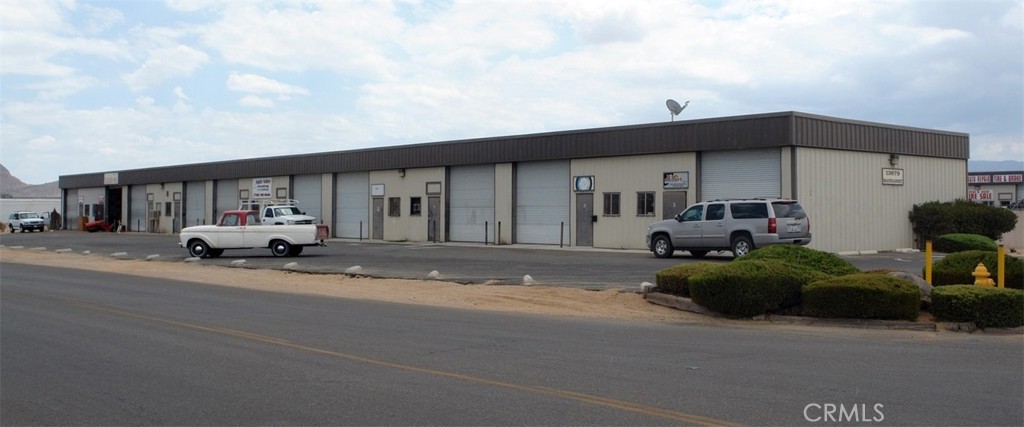 This versatile ±1,000 square foot space features two private offices, a restroom, and a small warehouse area—perfectly suited for light industrial use, storage, or small business operations. As a desirable corner unit, it offers added visibility and ease of access.