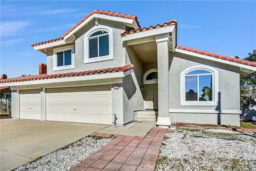 Welcome to this warm and inviting 4BD/2.5BA home in the desirable Victoria Groves neighborhood of Rancho Cucamonga, situated on a peaceful corner lot. An elegant double-door entry opens to bright formal living and dining areas with vaulted ceilings, while the newly updated kitchen features stainless steel appliances, white shaker cabinets, chic quartz countertops, and a cozy breakfast nook. The inviting step-down family room offers a brick fireplace and sliding doors that lead to a spacious backyard garden filled with multiple fruit trees, creating a private outdoor retreat. Upstairs, all four bedrooms sit on one level, including a generous primary suite with mountain views, a walk-in closet, and an en-suite bath. Additional highlights include fresh interior paint, luxury vinyl plank flooring, new dual-pane windows, updated bathroom fixtures, a convenient downstairs laundry room, and a 3-car garage. The home is conveniently located near shopping, dining, parks, and scenic walking and biking trails—offering a serene yet convenient lifestyle in one of the area’s most sought-after communities.