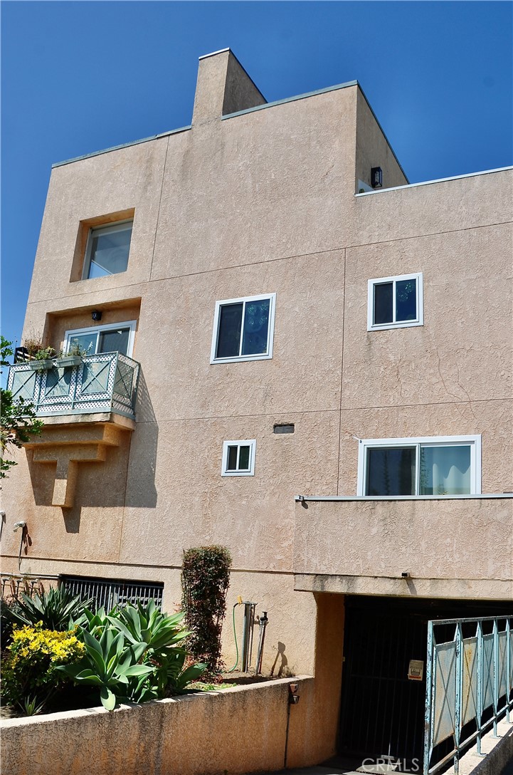 Welcome to 3439 Keystone Avenue! Located in the sought-after Palms neighborhood, nestled between Mar Vista and Culver City. This property is oozing with charm, featuring dramatic high ceilings and a rooftop deck with stunning city views. Newly renovated , this home offers 2 bedrooms, 2.5 bathrooms, PLUS a loft that opens up to a private rooftop deck. Both bedrooms come with en-suite bathrooms, showcasing beautiful black penny round tile flooring, subway tiles in the shower and tub, and elegant brass accents throughout, giving the bathrooms a refined yet modern style. One of the bedrooms has direct access to a private patio. The kitchen is fully equipped with appliances, and the living room is highlighted by striking floor-to-ceiling window and sliding doors that lead to a private second-floor deck. The soaring two-story ceilings create a spacious atmosphere with abundant natural light and breeze, providing a blank canvas for your choice of artwork, bookshelves, or lighting. The loft on the third floor has been enclosed for added privacy, making it ideal for use as an office or guest space. This room opens up to a very private rooftop deck adorned with city lights, offering ample space for greenery and lounge furniture. This gem is centrally located, with great proximity to UCLA, Westwood, Culver City, Mar Vista, and Venice's best restaurants and shopping. Yet, it remains tucked away on a peaceful street lined with majestic trees, ensuring the tranquility you crave after a hectic day in the city. Parking is a breeze with two assigned tandem spots behind the gate. This is truly an extraordinary place you won’t want to miss! INTERIOR PHOTOS COMING SOON!
