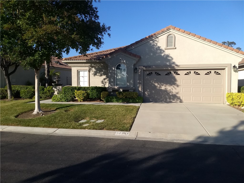 Enjoy "Life in Via Marisa & The Colony". The best kept secret is here in retirement living, with a secure, beautiful, peaceful and active environment. This is an extraordinary home full of upgrades and senior conveniences. Make your entrance known as you arrive through the stained-glass front French doors and come into the foyer glancing vestibule highlighting your favorite artwork. The next step is a great family hall room with stained wood engineered flooring reflecting the elevated glass block window's subdued light. Enter the spacious kitchen with granite countertops. This kitchen contains a pantry cabinet and many convenient upgraded sliding drawers for food and storage. Also see the large family room with rays of light passing through the plantation shutters, patio door and window. The newly painted interior walls provide a subtle sheen throughout the home. Additional benefits include a newer AC unit, water heater, ceiling fans. The master bedroom/bath has twin sinks and a centered vanity, full bathtub, a stand-alone shower, and walk-in closet. The private back yard patio is fully covered by Alum wood which opens to a quick gateway down the walking path. There is plenty of room in the two-car garage with a golf cart parking area.