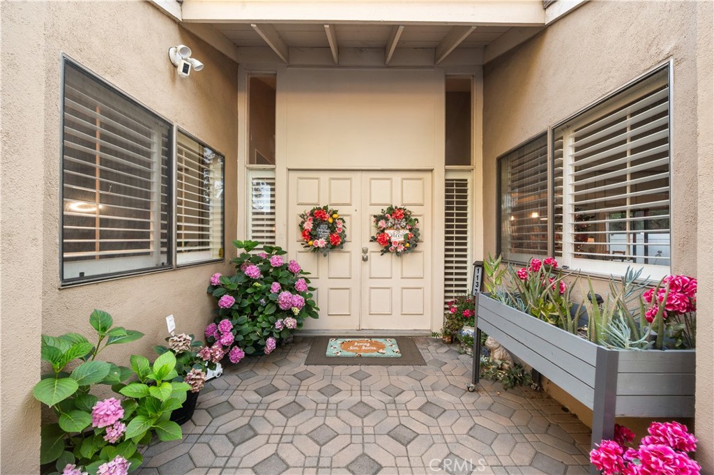 Spacious Corner Lot Condo with only one shared wall. Single Story! This 3 bedroom, 2 bath home is perfectly located giving it a spacious front yard. (no one above) Its Giant Double Door Entry is impressive and as you enter you are greeted at the entrance by a unique and relaxing atrium. The kitchen has been perfectly remodeled with timeless features such as white shaker cabinets, plenty of pull out drawers, giant sink, stainless steel appliances, and large quartz countertops, with extra space for additional counter height seating. The kitchen, dining, and living room are fully open which is very convenient for entertaining. All 3 bedrooms are on the opposite side of the home allowing for privacy while hosting. There is newer vinyl plank flooring through-out the home. The living room has vaulted ceilings and a cozy fireplace. This unit is also located near the guest parking and the HOA covers, front lawn maintenance, water, trash, basic internet, and basic cable! This is a very commuter friendly location. ***More photos to follow. Schedule your showing today.