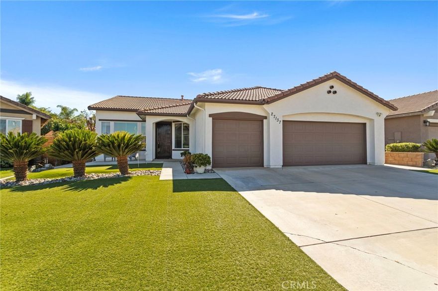 Beautiful Single Story Pool Home nestled on a quiet street in the Menifee Valley Ranch neighborhood.  There are so many wonderful features in this 4 bedroom home designed for entertaining and comfortable living with its spacious and open floor plan.  Right away you will notice the drought friendly landscape with your own personal 3-hole putting green on grass turf. The living room and dining room have high ceilings letting in abundance of natural light. In the chef's kitchen opening up to the family room, you have granite countertops, touchless faucet, large kitchen island with large basin sink, and plenty of storage. Family room offers cozy fireplace. In your private backyard oasis enjoy many features...the sparkling pool with waterfall and a Baja shelf to lounge in, BBQ island with firebowl, patio cover with ceiling fans and mounted tv. Large master bedroom has black out curtains and master bathroom with custom built spacious walk-in shower.  Additional features are 3 car garage, leased solar, smart home thermostat, THX surround sound and more.  This community is close to shops, restaurants, freeway, biking and hiking trails.