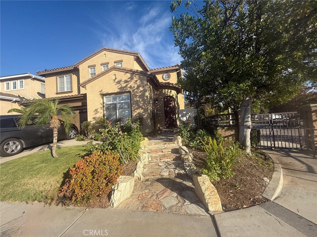 Welcome to this Beautiful home located in Anaheim Hills. It is truly an entertainer's delight! Built in 2002, this home features many amenities starting with the eye capturing curb appeal. As proceed towards the home, you will notice the unique foyer entrance. A living room to the left, a formal dining room to the right. Straight ahead, will open up to a large family room with a fireplace, and a beautiful kitchen with granite counters, an island, and a walk-in pantry. Walk upstairs and you will notice a grand entrance to the Master Bedroom. The Master Bath includes His and Her sink's with a separate powder area for the ladies. Walk in closet, shower, and separate tub makes this bathroom complete. Upstairs bedrooms have walk in closets, and jack and jill bathroom. Upstairs Bonus Room with a separate office area and upstairs laundry room. You will notice the brand new flooring throughout the home along with your oasis of a Backyard. Including a relaxing spa, 2 waterfall, water drip system throughout the flower beds surrounded by gorgeous trees providing that prefect amount of shade. All of these amenities are located within a private gated community offering easy access to shopping, dining, and the 91 & 241 Fwys.