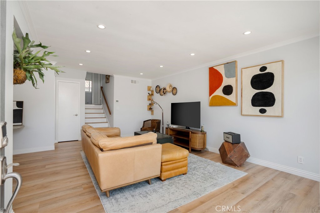Welcome to this bright and stylishly upgraded 3-bedroom, 2-bath townhouse offering the perfect blend of comfort, functionality, and indoor-outdoor living. Tucked away in the heart of a serene community—away from street noise—this home is ideal for both relaxed living and productive remote work.
As you enter through the front door, you're welcomed by an open-concept living room and kitchen, filled with natural light. Sliding glass doors lead out to a spacious front patio with sleek, low-maintenance pavers—perfect for effortless indoor-outdoor living and entertaining. Just a few steps up, you'll find two generously sized guest bedrooms with excellent closet space and a beautifully updated full bathroom. The expansive primary suite occupies its own level and boasts vaulted ceilings, a walk-in closet plus an additional standard closet, and peaceful views of the well-maintained community pool. The en-suite bathroom has been tastefully renovated with contemporary fixtures and finishes. Additional highlights include central AC, an oversized 2-car garage with laundry area, and thoughtful upgrades throughout. The community offer access to a pool, a spa, tennis court, and clubhouse.