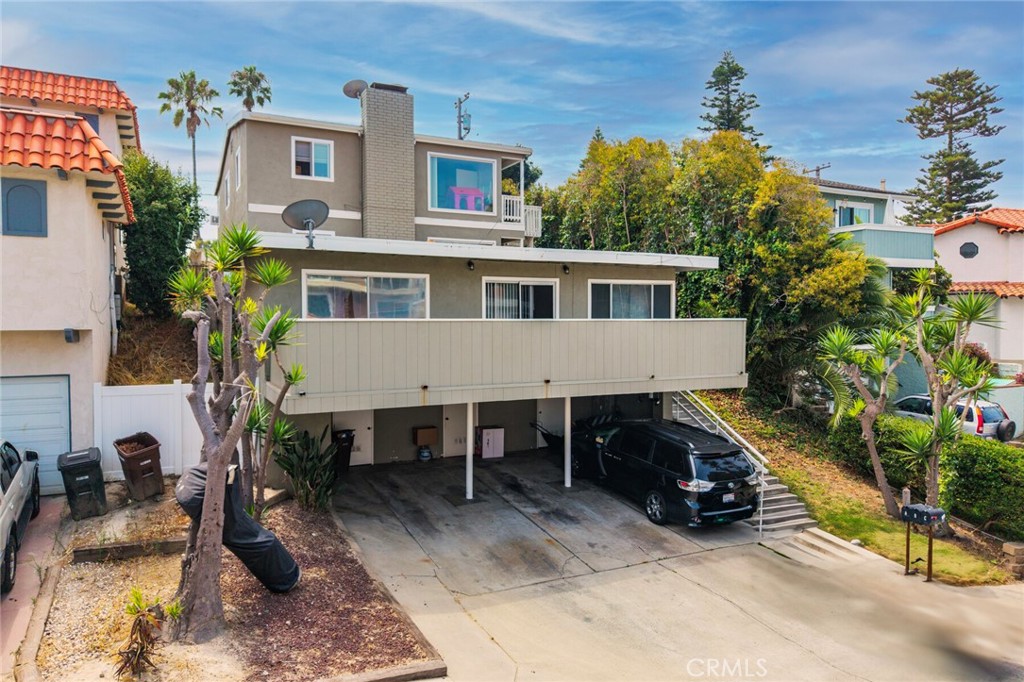 Exceptional beach close investment opportunity! Just a short stroll from the surf and sand, this well-located triplex offers three desirable units: 1bd/1ba, 2bd/1ba and 3bd/2ba. The property includes three covered carport spaces, each with convenient storage, and sits in an area known for strong rental demand thanks to its coastal charm and walkability. Whether you’re looking to expand your portfolio, secure a property with steady income potential, or explore the option of living in one unit while renting out the others, this is an ideal chance to invest in the vibrant beach lifestyle. Don’t miss the rare combination of location, versatility, and income-generating potential!