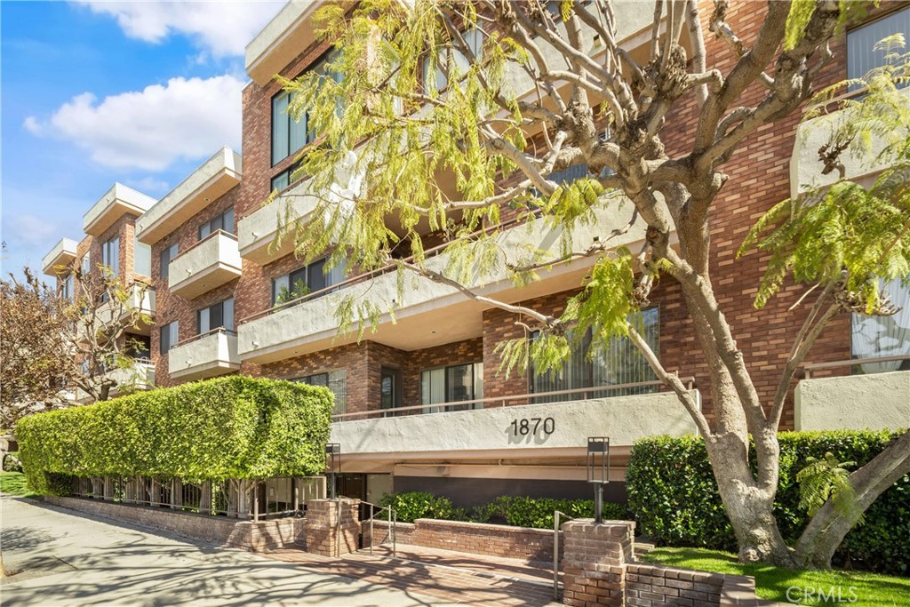 Located in the prestigious Westwood Ambassador, this move-in-ready 2-bedroom, 2-bathroom condo offers comfort, privacy, and top-tier amenities. Positioned in a quiet, rear-facing spot with east-facing natural light, it provides a peaceful living environment. It is just minutes from Westwood Village, Century City, Sawtelle dining, UCLA, and Santa Monica, with easy 405/10 freeway access . The property is also situated within the Westwood Charter School residential boundary.
Upon entry, the grand foyer makes an immediate impression with high ceilings, seamlessly opening into a spacious, light-filled living and dining area. Designed for both entertaining and relaxation, this open-concept space extends to a private outdoor terrace surrounded by lush greenery. Abundant natural light enhances the home’s warmth and sophistication.
The primary suite features high ceilings, a private balcony, walk-in closet, and spa-like bath with dual vanities and a soaking tub. A spacious second bedroom is near a full guest bath.
The gourmet kitchen includes stainless steel appliances with sleek stone countertops, and a charming breakfast nook. An in-unit laundry area features a side-by-side washer/dryer and ample storage. Newer HVAC system and updated engineered wood flooring ensures year-round comfort.
Enjoy building amenities designed for ultimate comfort and convenience, including secured entry, fitness center, sauna, pool, hot tub, billiard lounge, recreation room, and a rooftop deck with panoramic city views. HOA covers earthquake insurance, water, trash, security cameras, and guest parking. This unit includes two dedicated parking spaces and private storage units in a gated garage.
This tastefully curated residence offers elevated living in Westwood. Don’t miss this rare opportunity.