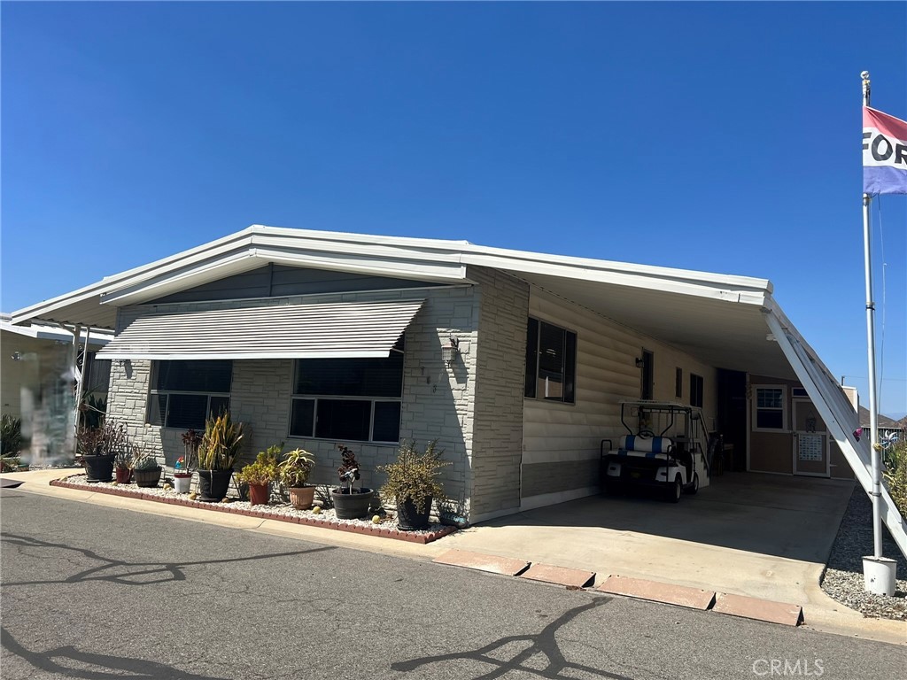 Located in one of the most nature filled and picturesque communities in the Valley. This community has Lakes, Waterfalls, Golf Course, Pool, Pickleball, Fishing, Shuffleboard, Community Events and many clubs and social options. This beautiful home has been updated and refreshed from kitchen to bathrooms. Bright, open space kitchen, gas stove on tiled island, double ovens, overhead vent, bright living room dining area and great room. Primary bedroom is large enough for a King size bed and wall closet with closet organizers and built in drawers for extra floor space and storage. Primary bathroom has been nicely updated with shaker cabinets and includes a walk in bath/shower.
2nd bedroom also has a large closet with built in wall drawers and bathroom includes an updated shower with tub.
Outside you will find a large deck and lower paved patio area with ample seating options to enjoy the sunsets. Carport area has side extenders to easily get in and out of your car. At the end of the carport you will find a very large shed nicely shelved and includes windows, vents and ceiling fan, plus extra storage area on the side of the shed.
You'll need to see the home for yourself to see the options and potential. So whether you like lots of nature, quiet times or a very social life with many community amenities and club options then this may be the home and community for you.