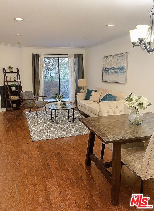 Location location location! Ideal West Side Condo Brentwood adjacent. Best deal in the area! Close to UCLA and restaurants. Easy freeway access. Updated kitchen with stainless steel appliances including stove, microwave, dishwasher and refrigerator with granite counter tops. Features include: crown moldings in living and dining room, wood floors, redone baths, mirror wardrobes, recessed lighting, balcony and fireplace in living room. Must see! Unit to be shown starting Monday, July 7. Some photos have been virtually staged. parking - 2 spots covered. small vehicles only. suv won't fit because of short ceiling