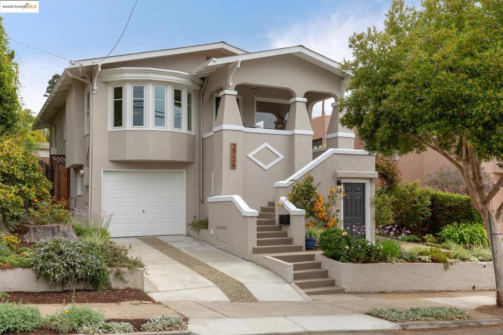 Lovingly maintained by the same owners for 22 years, this thoughtfully updated 4-bedroom, 2-bath home blends vintage character with modern comfort. The main level features a dining room with a beautiful original built-in and five-window bay, a living room with wall-to-wall built-ins flanking the fireplace, and inlay-detailed hardwood floors. The kitchen and bonus dining area open to a lush, flat backyard with mature fruit trees and plenty of space to dine, lounge, and play. A sunny bedroom and vintage full bath with hex tile complete this level. Downstairs offers three large bedrooms, including a versatile suite with original embossed-tile fireplace, laundry room, exterior entry, and interior garage access—perfect for a home office, guest quarters, or rental potential. Two bedrooms share a whimsical tunnel closet; one features a custom princess loft. A full bath remodeled in 2022 adds modern style while honoring the home’s vintage charm. With a newly paved driveway, one-car garage, and central location just blocks from Laurel District favorites—World Ground Coffee, Sequoia Diner, Degrees Plato Taproom, Farmer Joe’s, and more—you’ll love the easy access to both SF and the South Bay, plus weekend escapes to Redwood Regional Park for hiking, biking, and riding.