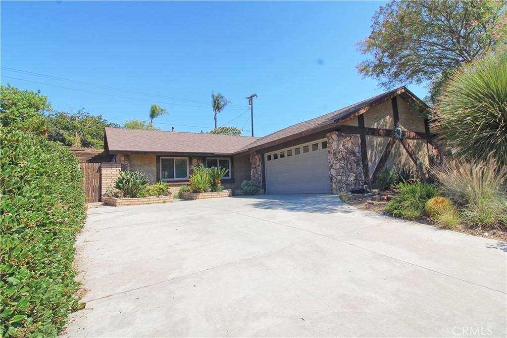 Come home to this spacious 3 bedroom, 2 bath home. Living room with large stone fireplace and laminate flooring. Bright kitchen includes prep table with overhead storage, built-in dishwasher, gas range and stainless steel refrigerator. Direct access 2 car garage with washer and dryer included. Covered rear patio, private backyard with low maintenance and drought tolerant landscaping and side yard area with shed.