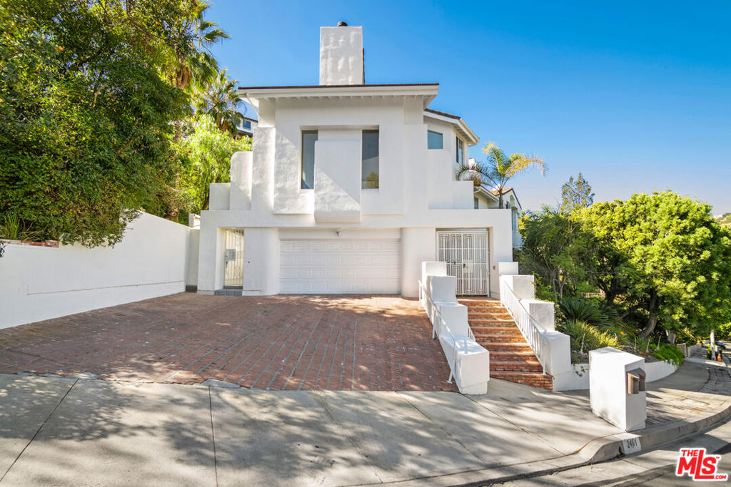 This exquisite newly renovated 5 bdrm 4.5 bath home offers privacy, and luxury living at its finest! Nestled in the hills but minutes to the studios, downtown, the westside, and the valley. Gorgeous brand-new chef's kitchen, fully appointed master suite with an amazing view, a fireplace, a walk-in closet, and a striking bathroom. The guest suite is accessible from inside the main house, and the outside staircase can be permitted under the new ADU (Additional Dwelling Unit), law. Additionally, there is a separate, detached free-standing office. An open floorplan is an entertainer's dream. Outside offers mature lush tropical landscaping, pool, hot tub, fountain, and waterfall over the plunge pool. Available now. Welcome, Home!!