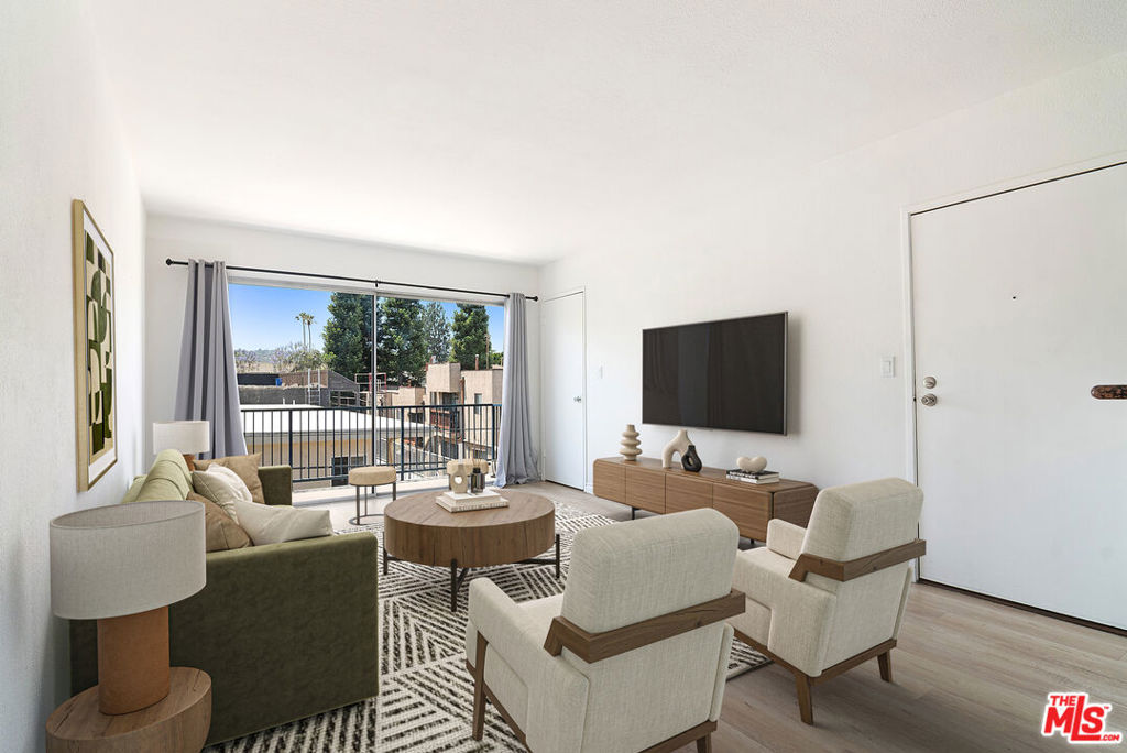 Welcome to this beautifully updated and uniquely designed 3-bed, 3-bath condo in a clean, contemporary Sherman Oaks complex. This rare corner-floor plan offers unmatched flexibility ideal for roommates, multi-generational living, rental, or an in-law setup. A second private entrance leads to an additional living area with a kitchenette, third bedroom, and full bath perfect as a guest suite or private retreat. Main entrance leads to this light-filled unit featuring spacious bedrooms with large closets, sleek modern bathrooms, and an open-concept layout that flows seamlessly from the dining area to a well-appointed kitchen with granite countertops and stainless steel appliances. There's even a dedicated space ready for an in-unit stackable washer and dryer. Enjoy your morning coffee or unwind in the evening on your private balcony with peaceful views. The gated complex is meticulously maintained and includes a swimming pool, dry sauna, and community laundry room. Subterranean tandem parking for two cars is included, with plenty of street parking available. Just minutes from Ventura Blvd, the 101 and 405 freeways, Van Nuys Middle School, Westfield Fashion Square, Trader Joe's, Whole Foods, and a wide array of restaurants, entertainment, and shopping destinations. (photos are digitally staged)