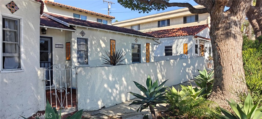 Beautifully updated 1-bedroom, 1-bathroom unit nestled in a well-maintained triplex community. The home features an updated kitchen with stylish finishes, warm wood flooring throughout, and a rear yard—perfect for relaxing or entertaining. Ideally located within walking distance to the beach, this unit offers the perfect blend of comfort, convenience, and coastal living.