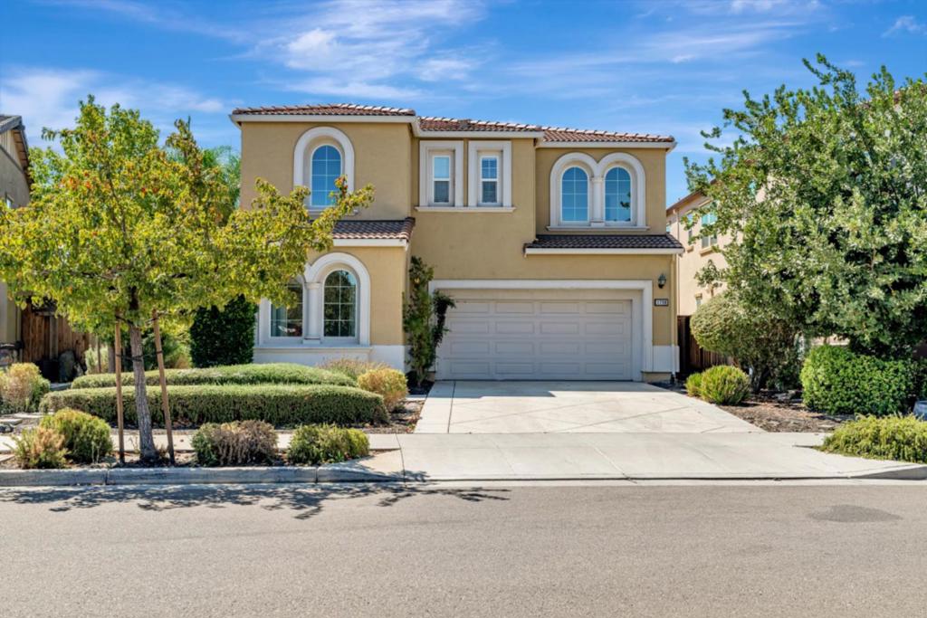 Welcome to this two-story home offering 2907 sq. ft of thoughtfully designed living on a 5,000 sq. ft lot. The east-facing front door welcomes you into a soaring vaulted ceiling entry, while 9-foot ceilings and abundant natural light create an airy atmosphere throughout. With 4 bedrooms, 3 baths, a versatile loft, and 2-car garage, this residence blends luxury with practicality. Inside, the great room, dining area, and chef-inspired kitchen flow seamlessly perfect for entertaining or everyday living. The kitchen boasts shaker-style soft closing cabinetry, granite counters, stainless steel appliances, gas cooktop, and a generous island with breakfast bar. Upstairs, the primary suite with scenic views offers a private retreat with dual vanities, soaking tub, walk-in shower, and two walk-in closets. Two guest bedrooms share a full bath, while the loft provides flexible space ideal for office, media room, or convert into a fifth bedroom. Step outside to a private backyard oasis with a charming pergola and no neighbor behind-perfect for dining, gatherings, or peaceful relaxation. Upgraded flooring, recessed lighting, laundry with W&D. This move-in ready home combines modern design, energy efficiency, abundant natural light, and timeless comfort - a perfect place to call your own.