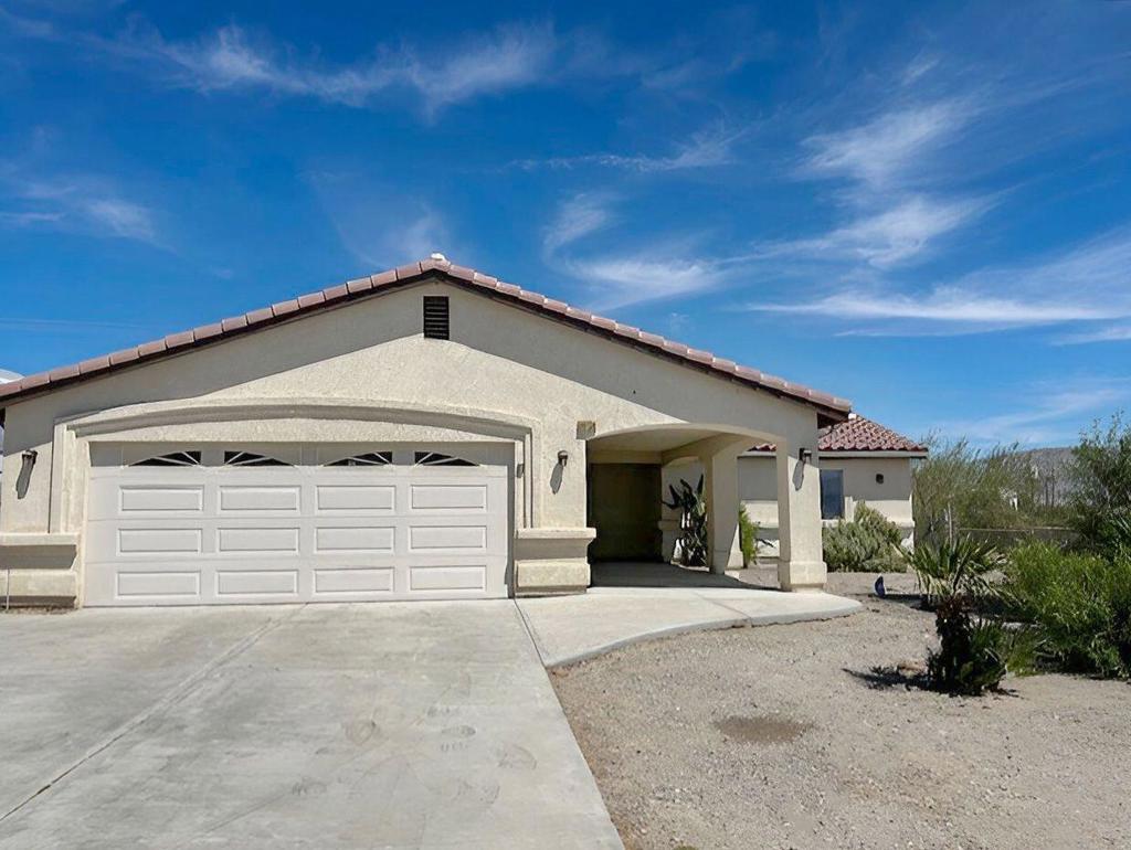 Located 2 blocks from Pierson Blvd and HWY 62, this move-in ready single-story home has mountain views. Welcome to this beautifully maintained single-level residence, offering 3 bedrooms, 2 baths, and 1,633 square feet of thoughtfully designed living space on an expansive 13,939-square-foot lot. Built in 2008, the home has been refreshed with new interior paint and carpeting, creating a bright and inviting atmosphere throughout. The kitchen features a step-in pantry and a brand-new stove, blending function with comfort. In the living room, a ceramic tile fireplace adds warmth and character, while large windows capture sweeping mountain views that frame the home with natural beauty. Additional features include a finished two-car attached garage, a durable tile roof, and generous outdoor space, offering endless potential to personalize and enjoy. This move-in ready home combines comfort, practicality, and a scenic setting - an ideal retreat for everyday living. Home is located in the City of Whitewater but under the sphere of influence of Desert Hot Springs.