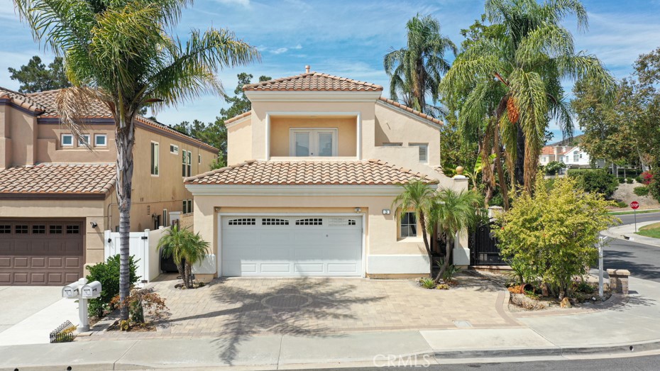 Nestled on a premier corner lot in one of South Orange County’s most sought-after neighborhoods, this exquisite 4-bedroom, 3-bathroom residence spans 2,733 sq. ft. of elegant living space on a 5,175 sq. ft. corner lot.
The open-concept living room showcases soaring ceilings, bathing the space in natural light and creating an inviting atmosphere ideal for both everyday living and sophisticated entertaining. The primary suite is a true retreat, complete with a spa-inspired ensuite bathroom and generous walk-in closet. Three additional bedrooms offer versatility for family, guests, or a home office.
Step outside to your private backyard oasis, where a sparkling pool and a built-in BBQ area set the stage for memorable gatherings. Lush fruit trees including pomegranate, lemon, apricot, mango, and banana, add both charm and the opportunity to enjoy homegrown delights.
Additional highlights include energy-efficient leased solar panels for reduced utility costs and the home’s coveted location, offering seamless access to the CA-241 Toll Road, as well as premier shopping, dining, and top-rated schools.