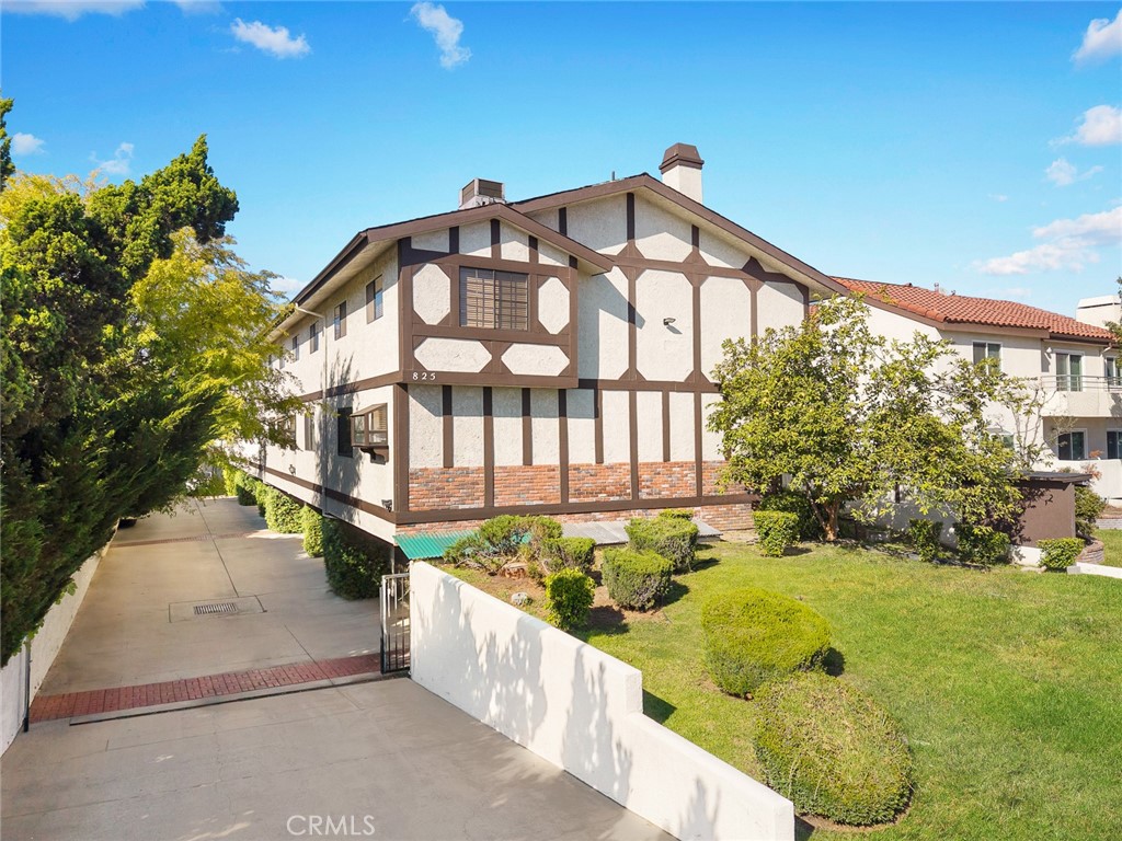 This charming townhouse is located in the heart of Arcadia, within the highly distinguished Arcadia Unified School District. Beyond a gated private yard, you are welcomed into a spacious living room with large windows that fill the space with natural light and a breezy atmosphere. A brick fireplace and laminate flooring add an elegant touch. The updated kitchen offers abundant cabinetry, ample counter space, recessed lighting, and stainless-steel appliances and it is perfect for preparing meals and entertaining. Adjacent to the kitchen, the open dining area features beautiful wooden ceiling beams that add warmth and character. Upstairs, the expansive primary suite impresses with high ceilings and exposed beams, creating a luxurious, open feel. The primary bathroom was renovated and with a sliding barn door. The home also includes a large laundry room with extra storage and a convenient countertop for folding. Additional highlights include move-in ready condition, polished interiors, and an attached two-car garage with plenty of storage space. Ideally situated near Westfield Santa Anita Mall, the LA County Arboretum, 99 Ranch, Vons, restaurants, banks, and parks. With its prime location and award-winning schools, this is a wonderful opportunity to own a lovely home in Arcadia!