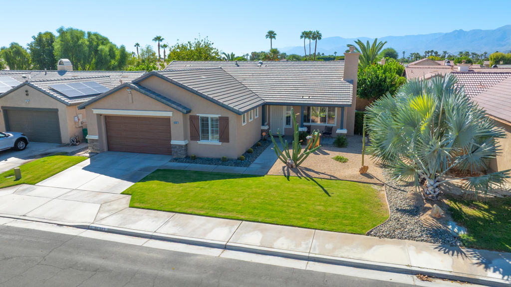 In the heart of Indio lies Montego Dunes, a highly sought-after neighborhood popular with both locals and investors for its ideal location near Highway 111, JFK Hospital, and the Empire Polo Club--home of the Stagecoach and Coachella music festivals.Arriving at 80683 Martinique, you'll immediately notice the pride of ownership reflected in its excellent curb appeal and well-kept exterior. Step inside and you'll love the bright, open great room where the kitchen, living, and dining areas seamlessly flow together--perfect for modern living. The efficient kitchen offers generous countertop and cabinet space, thoughtfully positioned at the center of it all.The primary suite is privately situated at the rear of the home, featuring a large sliding glass door that floods the room with natural light and opens to the beautifully landscaped backyard. Two additional bedrooms are conveniently located near the second bathroom, while the fourth bedroom is an expanded bonus room--ideal as a studio, home gym, or professional office.Just one house away, you'll find a charming community park with a grassy play area, shaded playground, and benches--alongside a spacious, gated dog park with plenty of room and shade for your four-legged friends to let loose.Montego Dunes is loved for its small, quiet feel while being right in the middle of everything with NO HOA's! The sense of community is strong, and once you explore the 3D VR Tour, home, and neighborhood, you'll see exactly why residents love living at Montego Dunes.