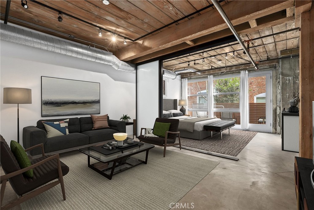 Experience the ultimate in urban living with this rare Barker Block loft offering a private outdoor patio and access to resort-style amenities. The rooftop pool and spa feature sun decks, cabanas, and BBQ grills, alongside a fitness center with city views—perfect for relaxing or entertaining. The open floor plan showcases exposed wood rafters, beams, and polished concrete floors, blending industrial charm with modern comfort. A partial sliding glass door allows you to create a separate living or bedroom area. The kitchen features granite countertops, while the large designer bathroom and two spacious wardrobes provide ample storage. This 24/7 secured building includes one covered parking space (HOA), with plenty of free street parking and nearby guest lots available. Located in the vibrant Arts District, this loft is directly across from Arts District Park, Urth Caffé, Zinc Café, and Blue Bottle Coffee. You’re just a short stroll to some of LA’s most celebrated dining spots including The Girl & The Goat, Bavel, Bestia, and Factory Kitchen. Additional highlights include in-unit washer and dryer, free WiFi in common areas, and easy access to major freeways. Conveniently located near USC, Sci-Arc, Hauser & Wurth, Soho Warehouse, Little Tokyo, Gold Line, DASH bus, and local dog parks, shops, and eateries.
