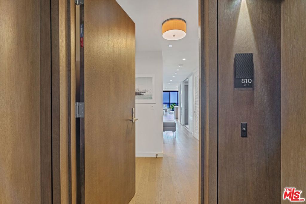Experience luxury coastal living in this two-bedroom condo + den with head-on, stunning ocean and park views from a wraparound terrace. The open kitchen features a breakfast bar and wine refrigerator, flowing into a bright living space. The primary suite offers three closets, including a walk-in, and a spa-like bath. A versatile den can be furnished as a third bedroom if desired. Includes two covered side-by-side parking spots and a storage cage. Located in a 24-hour concierge building complete with a pool, fitness center, and more. Also available for lease at $19,500 per month.