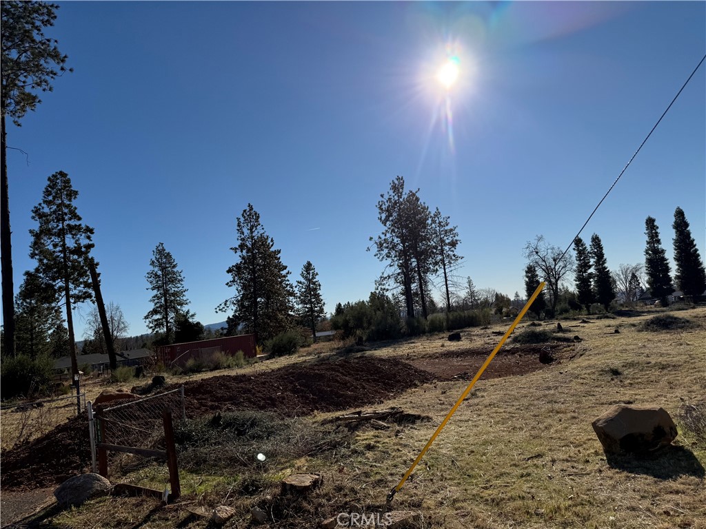 Don't miss your opportunity to own the beautiful piece of land located in the beautiful Town of Paradise. The land sits on just under an acre at 0.88. The lot is near schools, restaurants, gyms, and Clark Road for easy access to Chico and Oroville. Previous home was a 2-bedroom, 1-bathroom that boast 926 sqft. The septic tank (1500 gallon) and leech field are good. Bring your favorite contractor and start building your dream home today.
