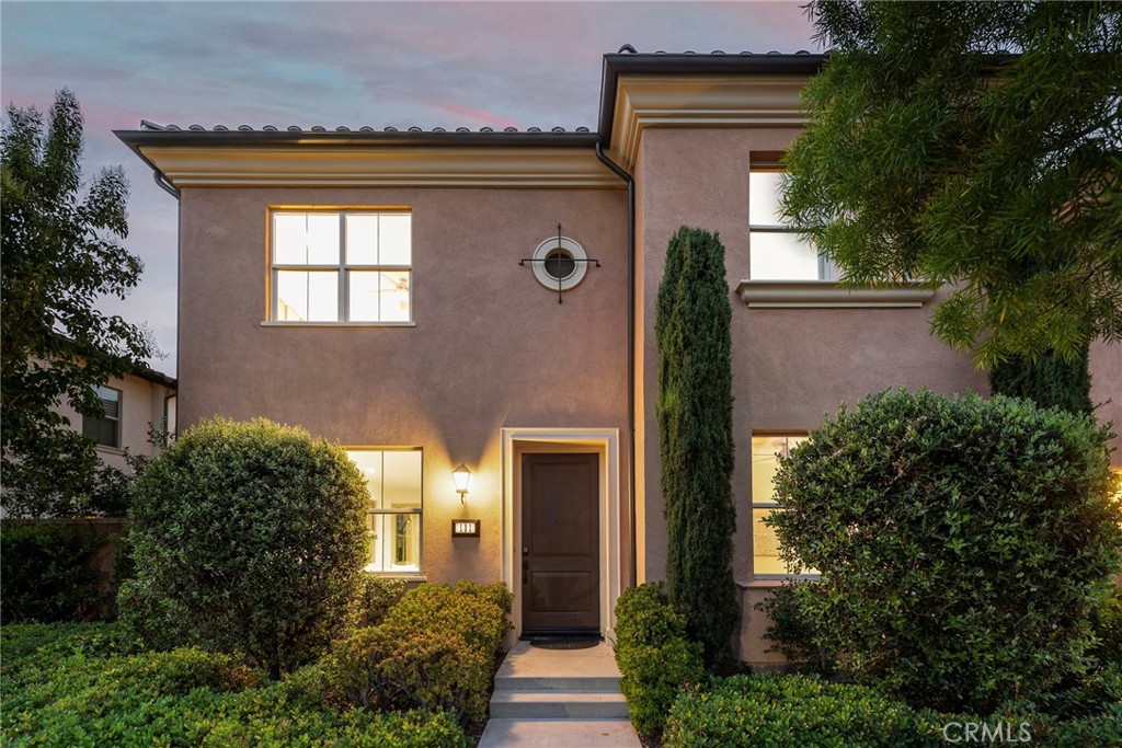 Welcome to 111 Henson, Irvine – a beautifully maintained residence located in the heart of Eastwood Village, one of Irvine’s most sought-after master-planned communities. This thoughtfully designed home offers a spacious open-concept layout with 4 bedrooms and 3 bathrooms, including a convenient downstairs bedroom for guests or multi-generational living. The gourmet kitchen features premium stainless steel appliances, durable and modern countertops, and an oversized center island that flows seamlessly into the dining and living areas—perfect for entertaining. Upstairs, you’ll find a warm and inviting primary suite featuring a walk-in closet and a thoughtfully designed bathroom, along with two additional bedrooms that offer comfort and flexibility for growing families or work-from-home needs. The home also features a charming side yard and an outdoor covered space ideal for tea time or casual gatherings, offering a cozy extension of the indoor living area and a great spot to enjoy Irvine’s year-round mild weather. Ideally located just one street away from the community clubhouse, pool, park, and greenbelt, the home enjoys one of the best locations within Eastwood Village. Whether you’re enjoying morning walks, weekend playtime, or quick access to community amenities, convenience is right outside your door. Located within walking distance to Eastwood Elementary and minutes from the Jeffrey Open Space Trail, this home also enjoys access to resort-style amenities including multiple pools, parks, tennis courts, and clubhouse. Zoned for top-rated Irvine Unified schools, including Sierra Vista Middle and Northwood High. With low Mello-Roos, modest HOA fees, and excellent walkability to both Woodbury Town Center and Northwood Plaza, this home offers not only comfort but also exceptional convenience and low ownership costs. Don’t miss this opportunity to own a turnkey home in one of Irvine’s most family-friendly neighborhoods.